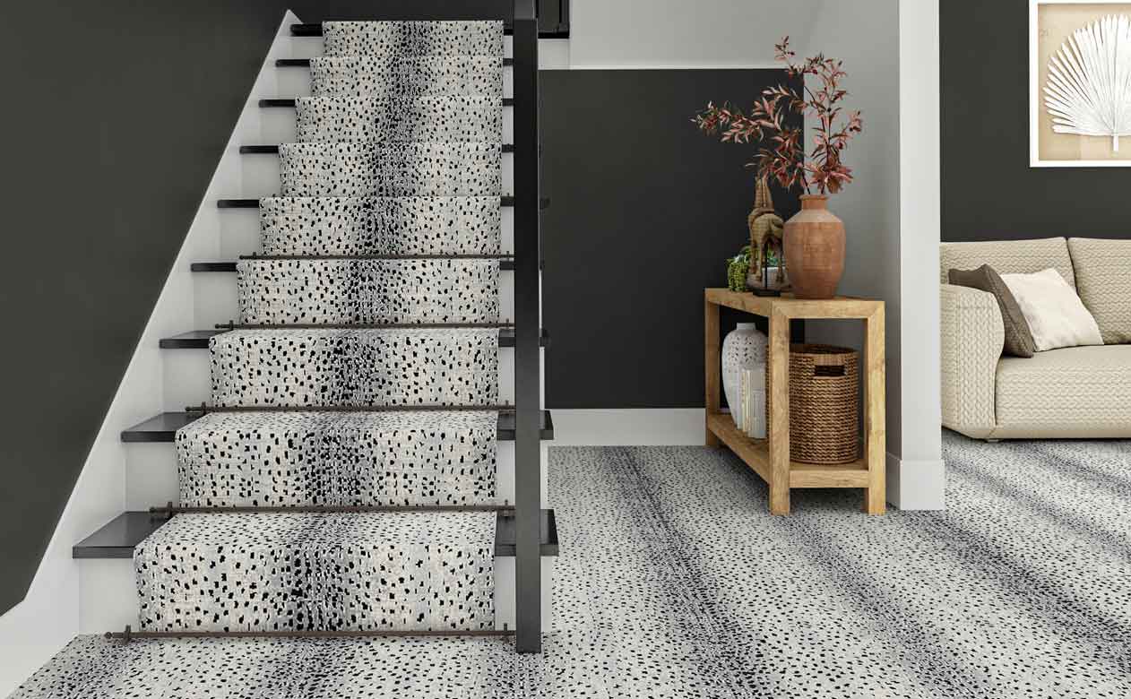 gray animal print patterned carpet in modern gray entryway with staircase